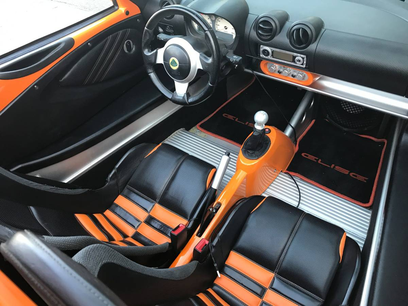 Illustration for article titled For $29,999, Could This Orange And Black 2005 Lotus Elise Have You Ready For Halloween?